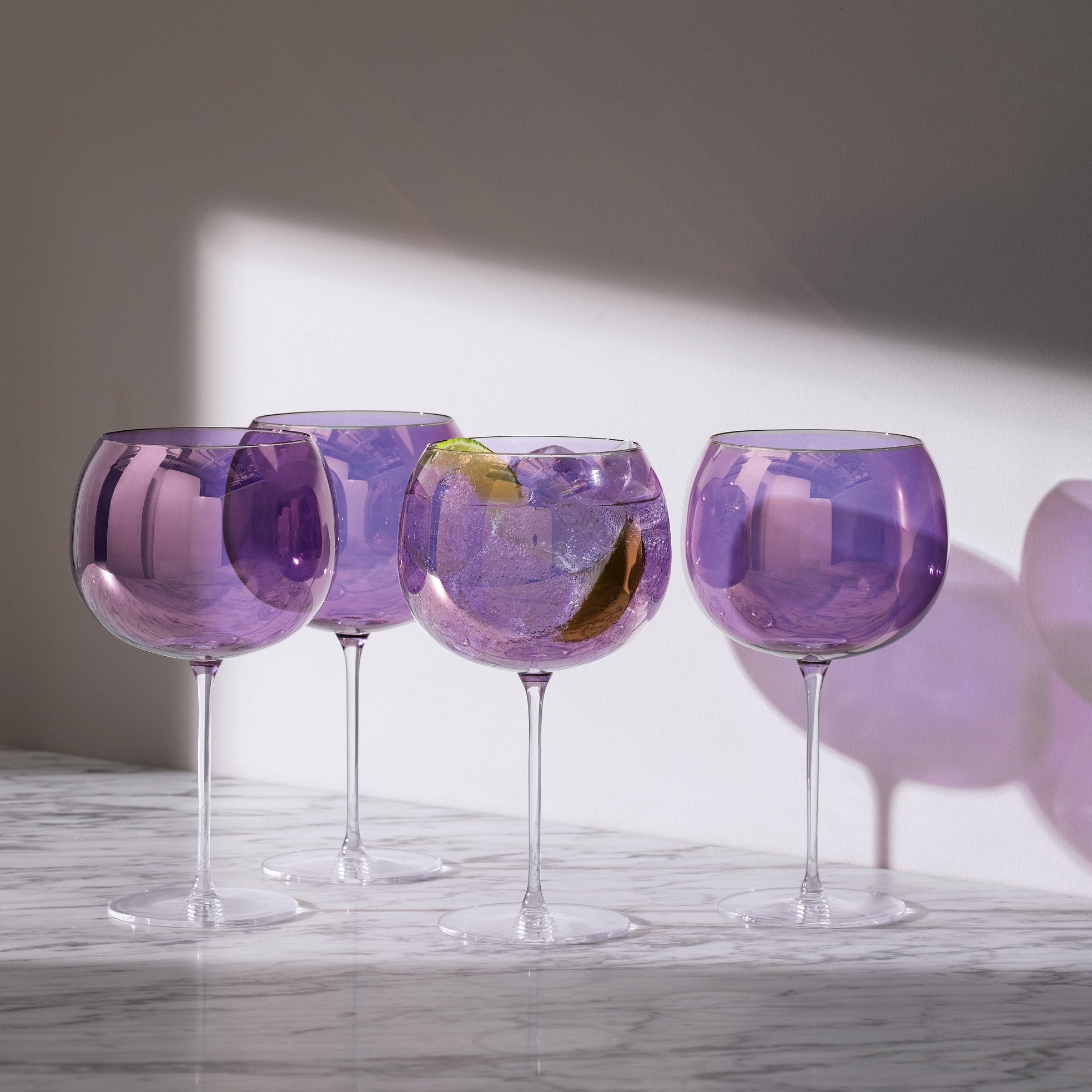 http://thebarcollective.com/cdn/shop/products/G1620-24-887-AURORA-BALLOON_GLASS-680ML-POLAR_VIOLET-LIFESTYLE-2000x2000-RGB.jpg?v=1664675976